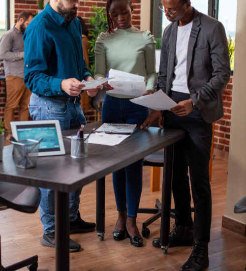 Colleagues reading company documents Colleagues reading company documents